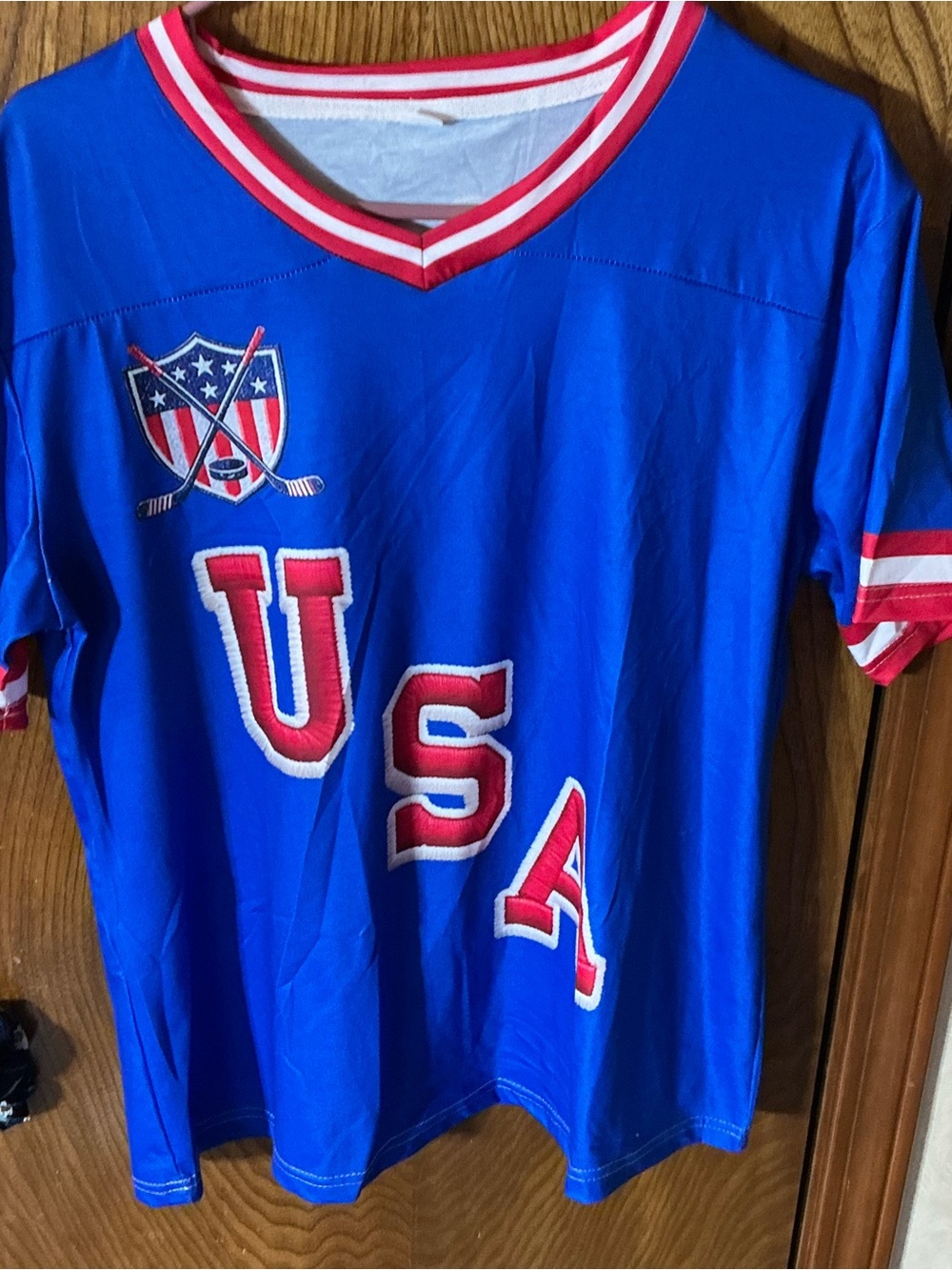 Blue USA hockey Jersey with Red 43 and HUGHES